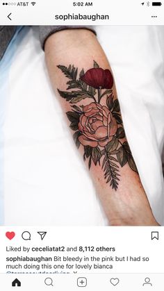 a person with a rose tattoo on their arm