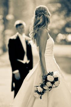 the bride and groom are standing outside together