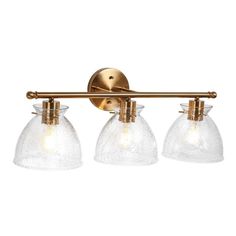 three light bathroom fixture with clear glass shades and brass finish, on an isolated white background