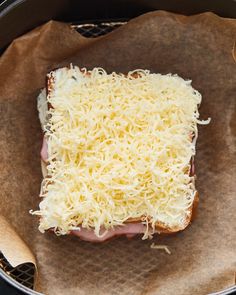 a piece of bread with cheese and meat on it