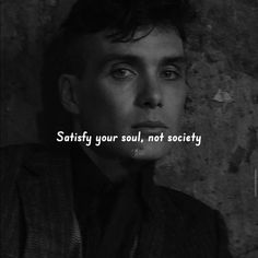 a man in a suit and tie with the words satisfy your soul, not society