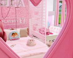 a bedroom with pink walls and decor in the shape of a heart