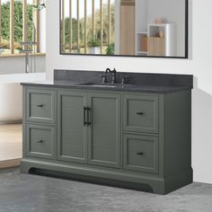 a bathroom with a sink, mirror and window in the background on concrete flooring