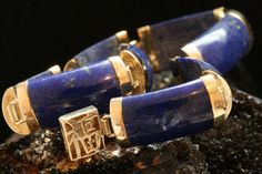 🖤 DESCRIPTION  Lapis Lazuli is one of the most sought after stones in history. Its deep, celestial blue, with flecks of gold, remains the symbol of royalty, honor, courage, wisdom and strength. It is often referred to a stone of the Gods. You will typically see these beautiful Chinese link bracelets made of jade, but it is a rare occurrence to see one made from the precious stone, lapis lazuli. The bracelet has eight links and each link is 3/4 of an inch. The links are connected by 10k gold and the bracelet is marked 10k. The beautiful clasp is also 10k gold and has the Chinese symbol for happiness. This bracelet makes an absolutely stunning statement! 🖤 SPECIFICS Length (Approximate): 7 Inches Metal Type: 10k Gold Total Item Weight: 11.4 Grams 🖤 SHOP Check out similar pieces in our sho Chinese Symbol For Happiness, 14k Gold Opal Ring, Chinese Bracelet, Gold Heart Bracelet, Celestial Blue, Lapis Lazuli Bracelet, Lapis Lazuli Jewelry, Gold Link Bracelet, Art Deco Diamond Rings