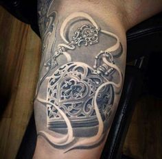 a man's arm with an intricate tattoo on it