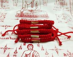 "10 pcs SAI SIN & Takut Bracelet Buddha Red Cord Thai Amulet Rich Wealth Protect Life / Thai Amulet Wristband Lucky Wealthy Holy Description Condition : Rare beautiful & Good Condition Material : Rope Cotton Silk Diameter : 3.0\" (Approx) Color : As Picture Quantity : 10 pcs. The best thing will come into your life if you believe in Thai amulets.  Just believe and pray.  This wristband is made of a white and yellow nylon thread with a wood bead,  and pass chanting ceremony from local Temples in Thailand, a gift from  the Monks, that protect you from evil, and made good luck. It has a pull cord adjustment to fit any size wrist , measuring 8mm in width , very strong and durable waterproof wristbands. An amulet (Latin amuletum) can be any question however its most essential trademark is its a Lucky Charms, The Monks, Wristbands, Lucky Charm, Made Goods, Cotton Silk, Wood Beads, Arm Band, Thailand