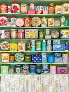 there are many different tins on the shelves