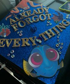 a blue graduation cap with the words ready to go for everything written in gold letters