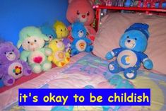 there are many stuffed animals on the bed with it's name written in blue