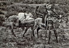 an old black and white photo of a man on a horse