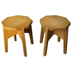 two wooden stools sitting next to each other