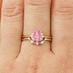 One of a kind ring Pink sapphire, 0.7ct., 6.79mm 0.04ctw G color SI clarity white accent diamonds Band width x height: approx. 1.5mm x 1.6mm Low profile, classic four-prong basket setting Made of 100% recycled solid 14k rose gold and ethically sourced gemstones Custom Order This ring is offered in other sizes, metal, and the center stone can be upgraded/downgraded to suit your preference. These requests can be accommodated as Semi-Custom Order. Click here to learn more about this service. About Rose Gold Pink Sapphire Ring For Wedding, Rose Gold Pink Sapphire Wedding Ring, Wedding Rose Gold Pink Sapphire Ring, Oval Pink Sapphire Ring In Rose Gold, Oval Rose Gold Pink Sapphire Ring, Rose Gold Oval Pink Sapphire Ring, Pink Sapphire Engagement Ring, Profile Classic, Pink Sapphire Ring Engagement