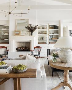 a living room filled with furniture and a fire place