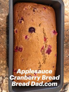 an apple and cranberry bread in a loaf pan