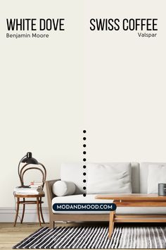 a white couch sitting next to a coffee table on top of a wooden floor in front of a white wall