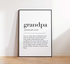 a black and white poster with the words grandpaa on it in an empty room