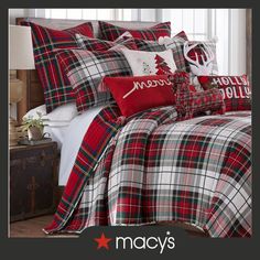 a christmas themed bed with plaid sheets and pillows