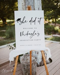 a welcome sign is on an easel for guests to take their place at the graduation party