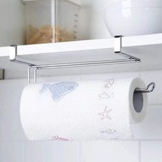 a roll of toilet paper is hanging from a towel rack