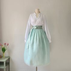 This is a Korean Modern Hanbok wrap style skirt for Women. This skirt is made of three layers, so it is beautiful without having to wear an underskirt with a natural voluminous feel. This hanbok is modernly designed so you can wear it comfortably and beautifully. This modern hanbok is perfect dress for daily and celebrations such as parties or various events. ⭐This skirt can be made in custom sizes. Please contact me if you would like to make your size. ⭐Please check out the link below for the white blouse in the photo. https://www.etsy.com/listing/1568387737/ ✔️Washing Method Dry cleaning is recommended for the first wash. Washable, please hand wash separately. Washing by twisting with excessive force may damage clothes. ⭐It can be matched with a variety of blouses top to create a beautif