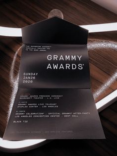 a piece of paper that is sitting on top of a chair with the namegrammy awards written on it