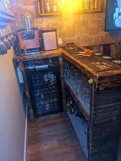 a small bar made out of pallets and wine glasses