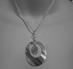 "Beautiful Italian jewelry maker KA 1772 modernist sterling pendant Oval pendant with smaller disc suspended inside the loop Pendant is 2 inches long and 1-5/8\" wide The chain is 3 strands, some tarnish on side, will polish before shipping The chain has adjustment links that are 1-1/2\" long" Modern Oval Large Pendant Jewelry, Modern Silver Oval Pendant Jewelry, Modern Silver Medallion Jewelry, Modern Silver Necklace With Oval Pendant, Modern Silver Round Disc Jewelry, Loop Pendant, Sterling Pendant, Italian Jewelry, Domed Ring