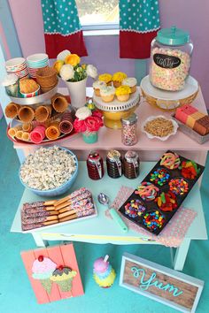 a table filled with lots of desserts and sweets on it's side,