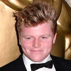 a young man in a tuxedo and bow tie