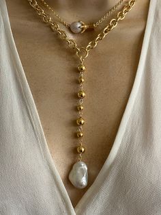 Statement pearl necklaces. Sold separately. 1. pearl Lariat features gold plated stainless steel oval link chain and combination of 8mm and 6mm gold plated stainless Steel beads. Coated large baroque pearl. Pearl size approximately 22mmx15mm. Necklace length around the neck is adjustable 16.5-18.5 inches. Drop 5 inches. 2. Claw charm features gold plated stainless steel claw charm and small baroque pearl. 18k rolo chain. Adjustable length 16-18 inches. 🎁All orders are shipped in a gift box. Gold Baroque Pearl Pendant Chain Necklace, Gold Baroque Pearl Pendant Necklace, Gold Pearl Charm Necklace, Gold Chain Necklace With Baroque Pearl Pendant, Gold Chain Necklace With Pearl Charm Dangle, Gold Pearl Necklace With Chunky Chain, Gold Jewelry With Adjustable Chain And Baroque Pearl, Gold Bohemian Jewelry With Adjustable Baroque Pearl Chain, Gold-plated Chain Necklace With Pearl Drop