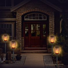 some lights that are on in front of a house