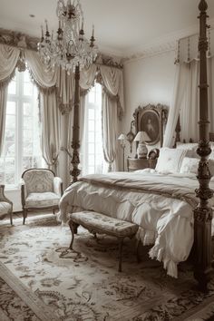 an ornate bedroom with four poster bed, chandelier and two chairs in front of the window