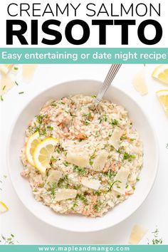 creamy salmon risotto in a white bowl with lemon wedges