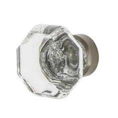 a glass door knob with a silver finish on the front and back of it's face