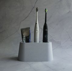 Minimalist electric toothbrush holder.  If you have a question about size of holes or you need specific dimensions please contact us. We can make it with drainage and tray under the holder itself if you want that option just choose it. Electronic Toothbrush, Electric Toothbrush Holder, Toothbrush Holders, Electric Toothbrush, Toothbrush Holder, Bulgaria, Brushing Teeth, Bathroom Decor, 3d Printing