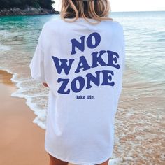 No Wake Zone, Lake Shirt , Retro T-shirt, Aesthetic Sweatshirt, Oversized t-shirt, Lake Shirt, Summer T-shirt Hi, welcome to CCAPPARELTX! If you are looking for trendy lifestyle apparel for your best moments in life, then you have come to the right place. You can find comfortable and casual clothing that you can CUSTOMIZE, for you and your loved ones. We hope you enjoy your time at our shop, the processing time is currently 1-5 days. If you would like to rush your order, please feel free to cont White Summer T-shirt For Outdoor, Relaxed Short Sleeve T-shirt For Vacation, Summer Tops For Beach Season Outdoor, White T-shirt For Summer Outdoor Activities, Graphic Print Top For Beach Season, Beach Season Short Sleeve Tops, Beach Season Outdoor Short Sleeve Tops, Relaxed Short Sleeve T-shirt For Beach, Relaxed Short Sleeve T-shirt For Beach Season