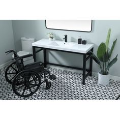 a bathroom with black and white tile flooring and a sink in the center, along with a wheel chair