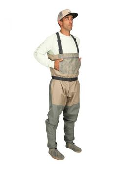 a man standing with his hands on his hips wearing an apron and waders,