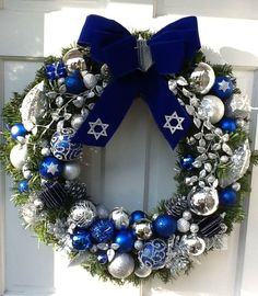 a wreath with blue and silver ornaments on it