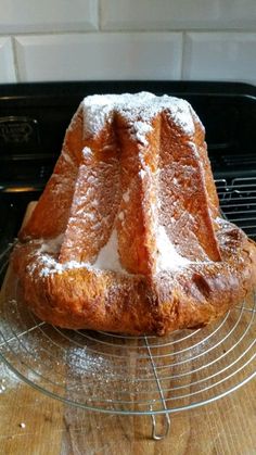 a cake sitting on top of a metal rack