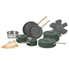 an assortment of pots and pans with wooden utensils