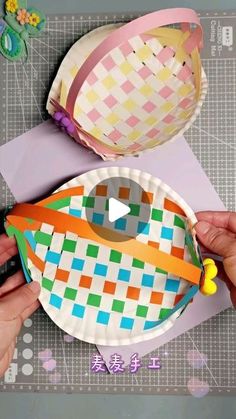 someone is making a basket out of paper