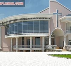 a large pink building with a cross on it's roof and two balconies