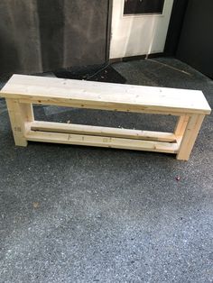 a wooden bench sitting in front of a door