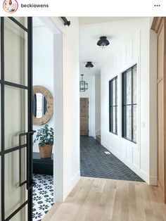 the hallway is clean and ready to be used as an entrance way for someone's home