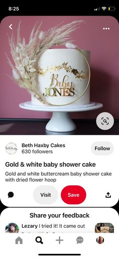 the cake is decorated with gold and white flowers on it's side, which reads baby ones