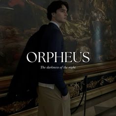 a man standing in front of a painting with the words ophelus on it