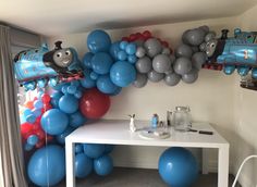 thomas the tank engine balloon decoration in a child's room