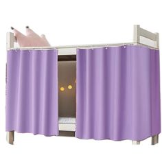 a bunk bed with purple curtains and a pink cat sleeping on it's side