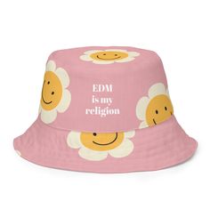 Double the fun with our reversible bucket hat! Featuring a playful flower design and our newly minted "EDM is My Religion" phrase on one side, and a classic droopy smiley on a sunny yellow background on the other, this hat is perfect for any occasion - music festival or otherwise.  Crafted from premium, moisture-wicking polyester, our bucket hat is both stylish and comfortable. The lightweight, linen-feel fabric ensures you stay cool and comfortable all day long. Whether you're hitting the beach Rave Hats, Streetwear Hats, Reversible Bucket Hat, Streetwear Accessories, Sunny Yellow, Yellow Background, Electronic Music, Music Festival, Smiley